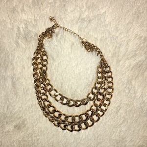 Gold colored 3-chain necklace
